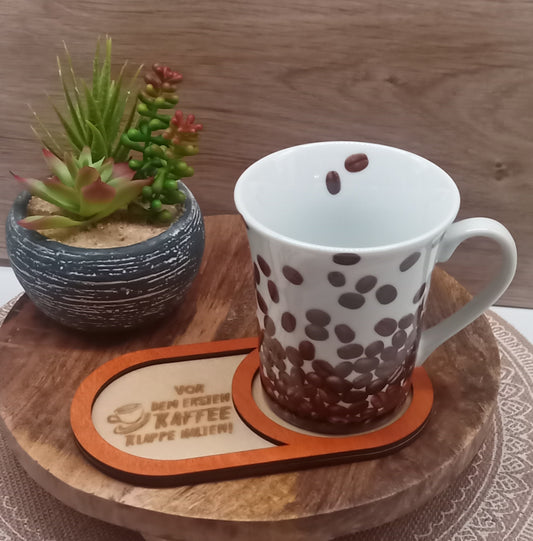 Kaffeeuntersetzer aus Holz mit persönlichen Spruch.